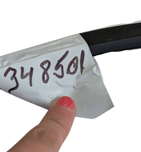 Hand holding a cable with a label showing '348501' on a white background